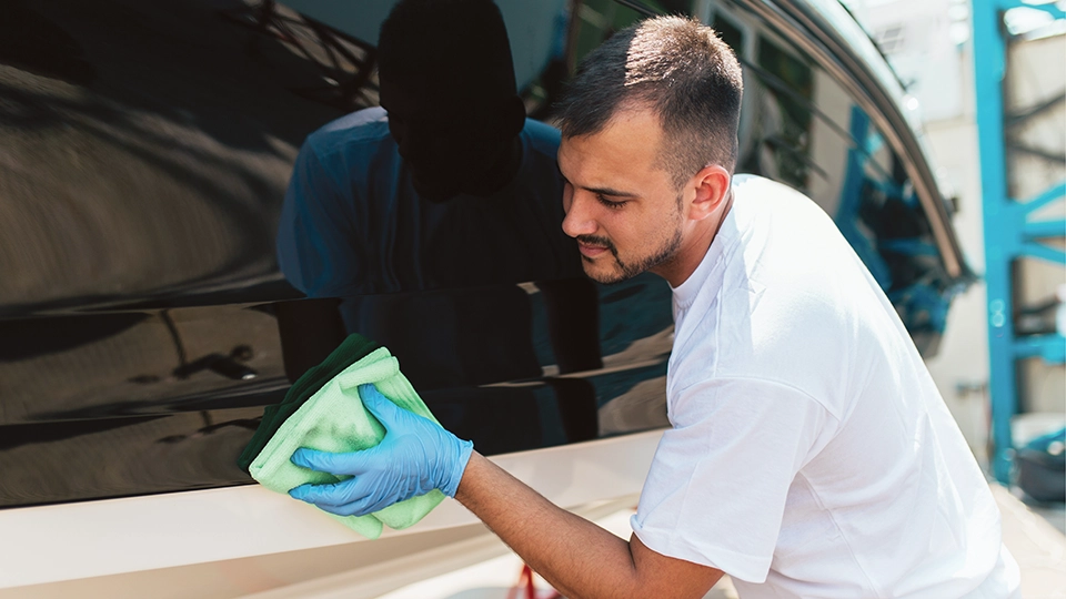 man preparing boat for storage at Mini Mall Storage